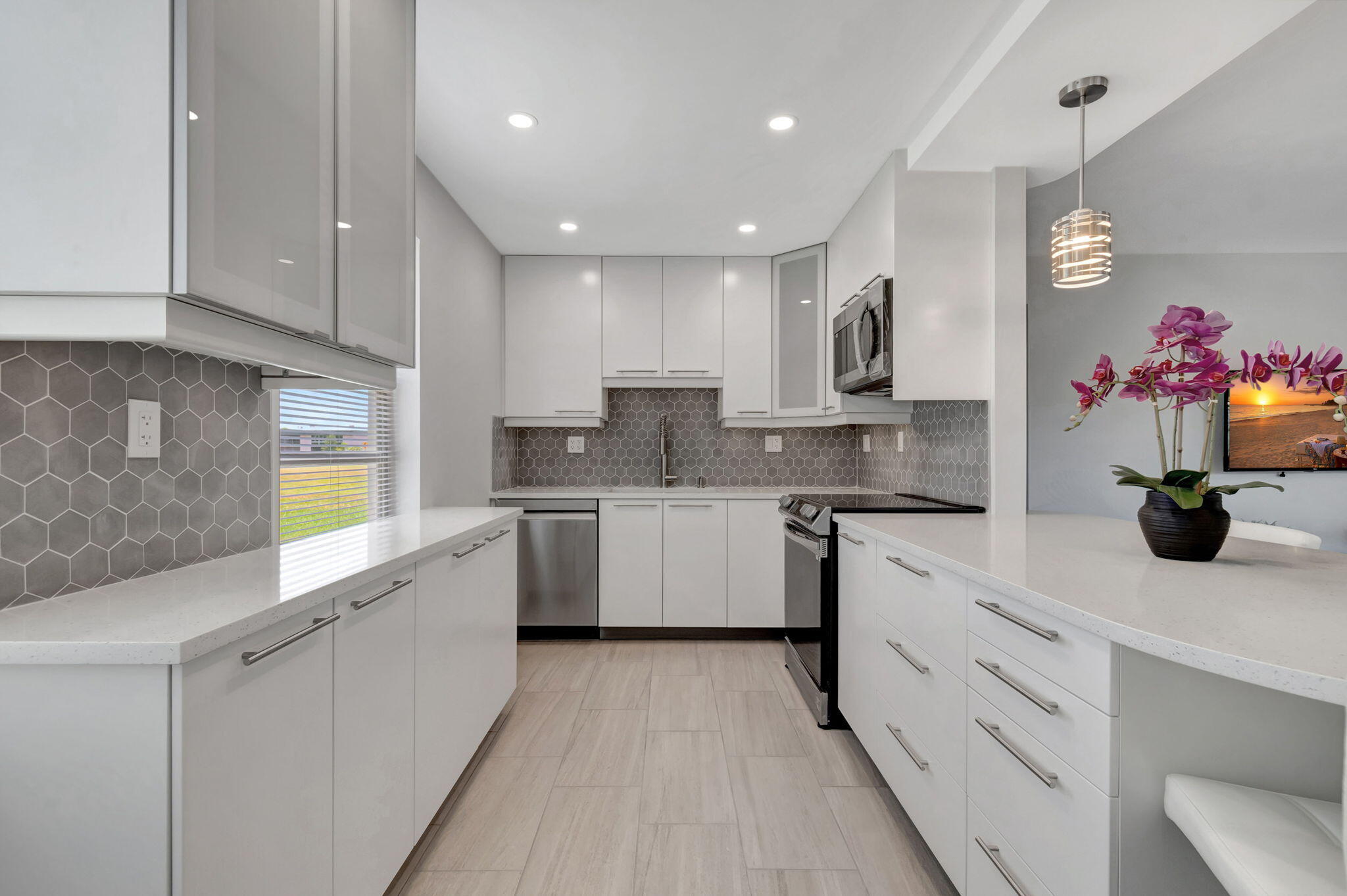 a kitchen with cabinets and window