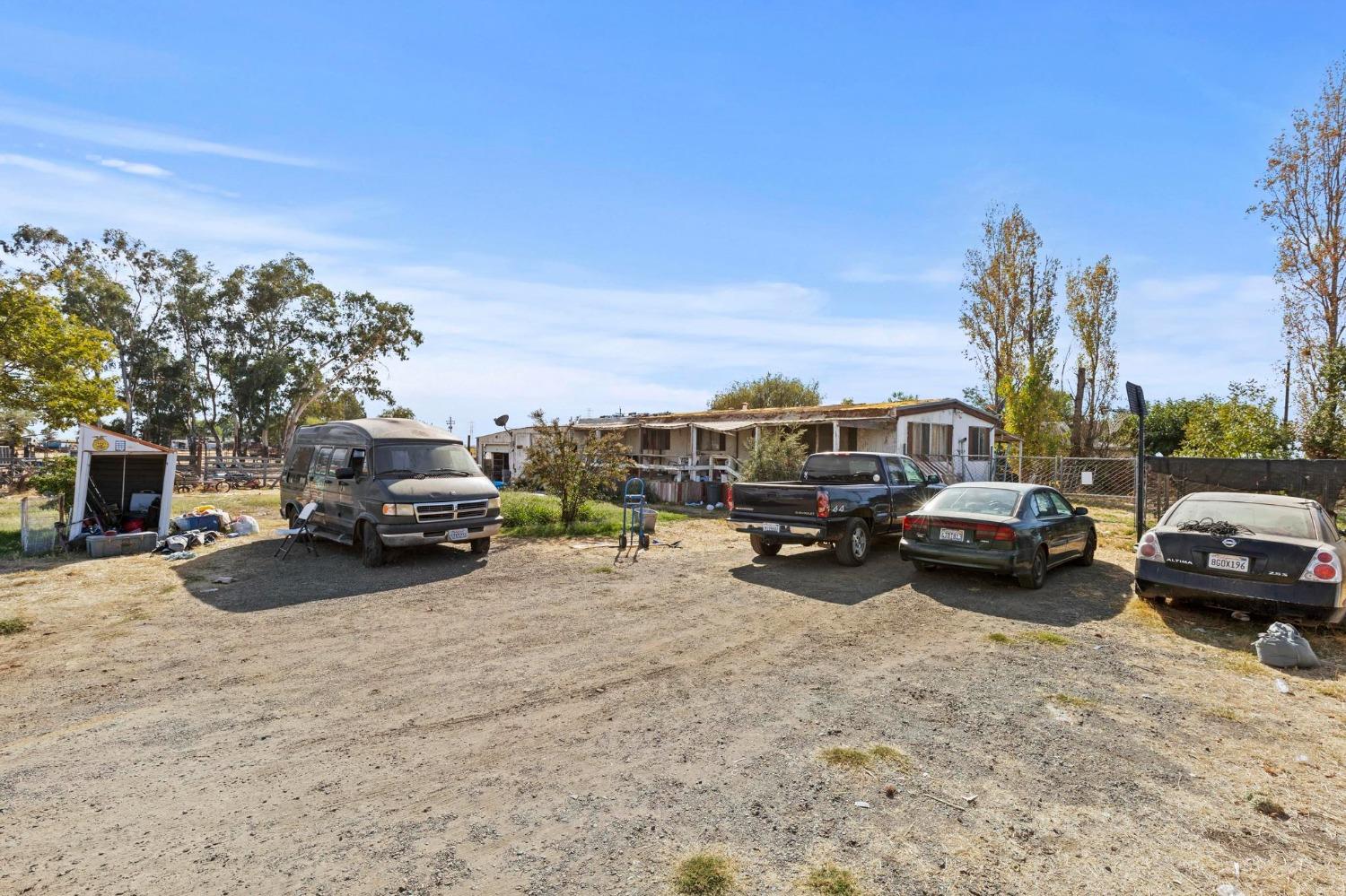 a view of a cars park in front of a house