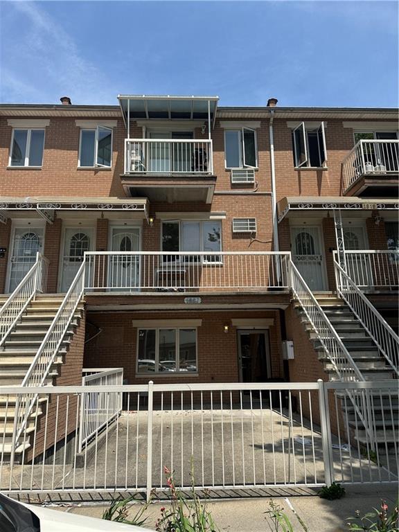 a front view of a house with a deck