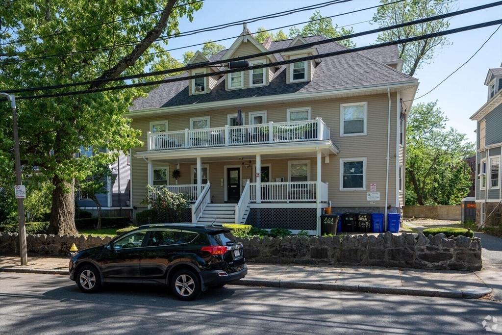 a car parked in front of a house