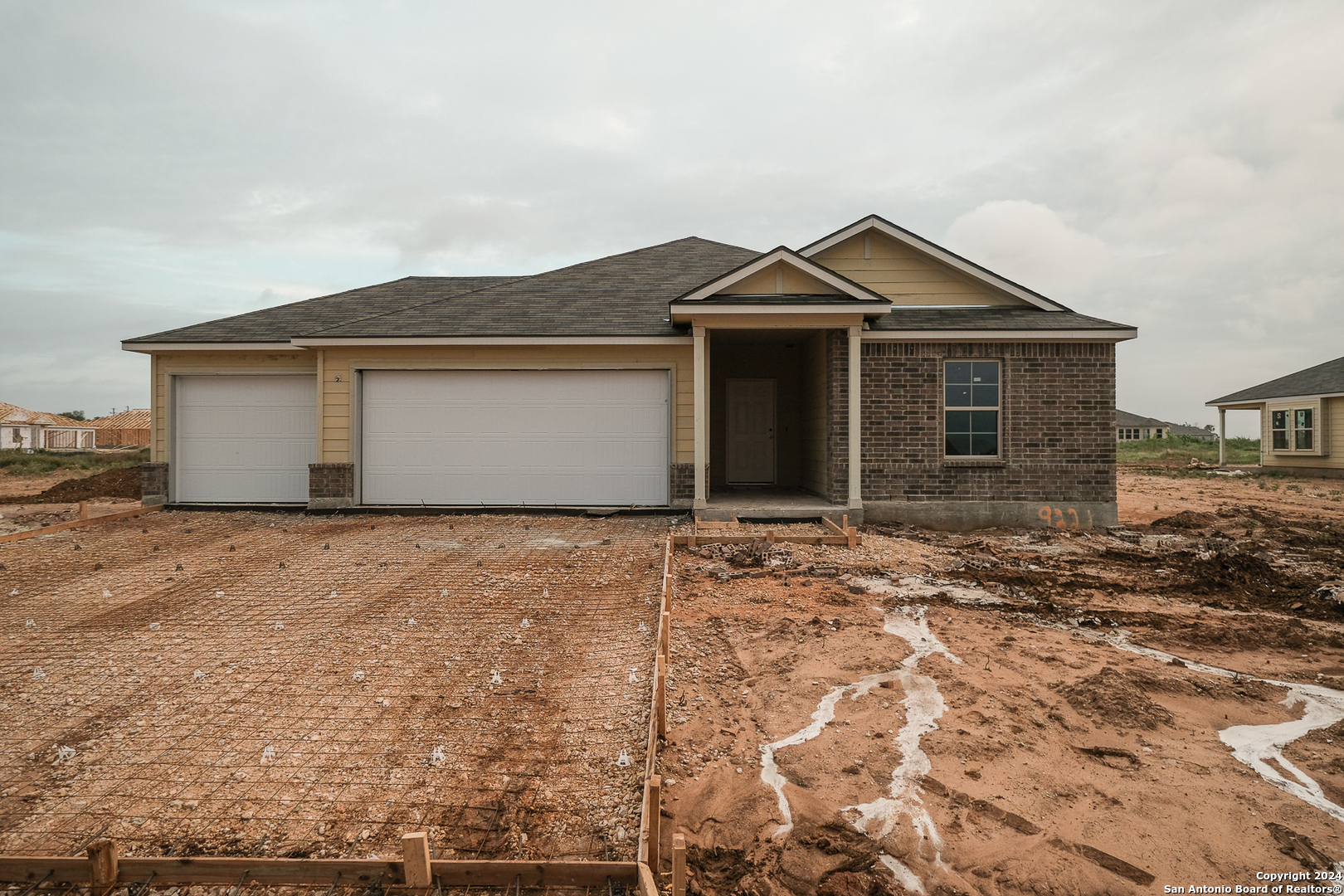 a front view of a house with yard