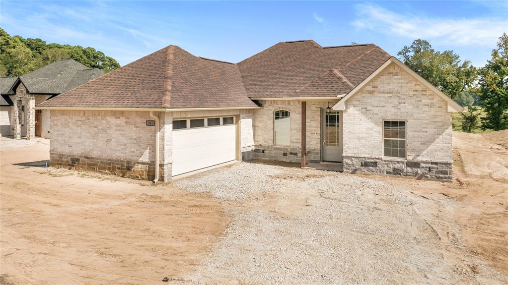 a view of house with yard and sitting space