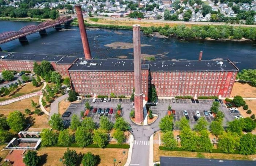 a picture of water with a building in the background