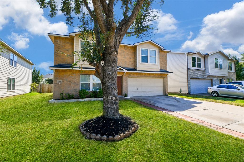 a front view of house with yard and outdoor seating