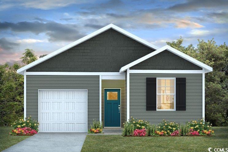 View of front of house featuring a garage and a la