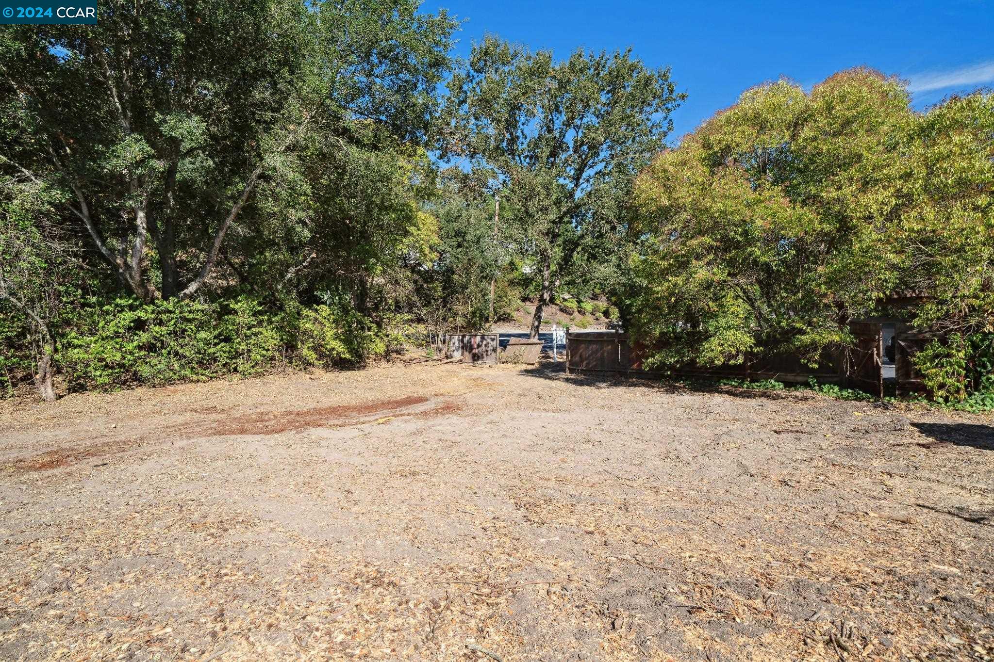 a view of large space with trees