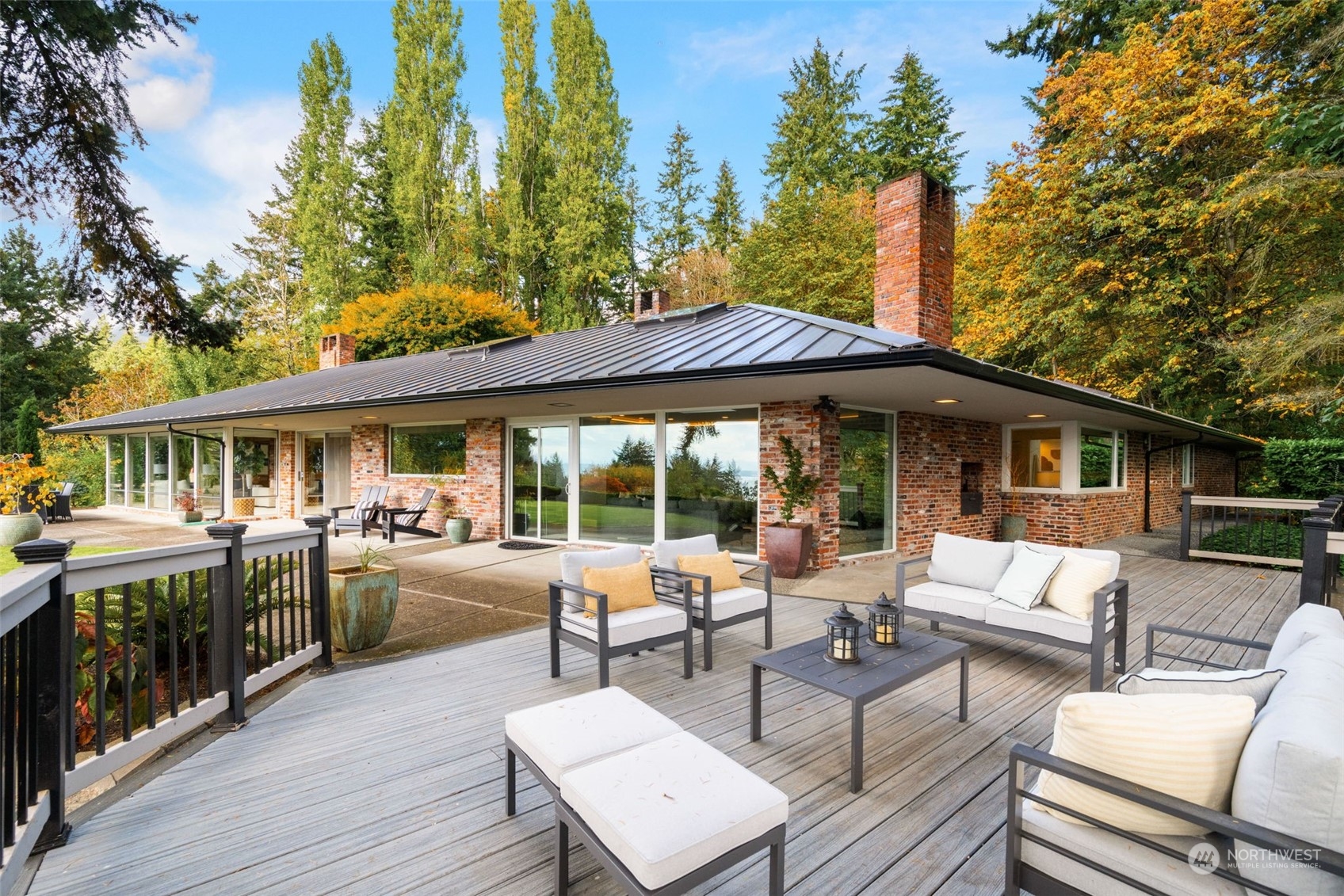 a view of a patio with furniture and wooden floor