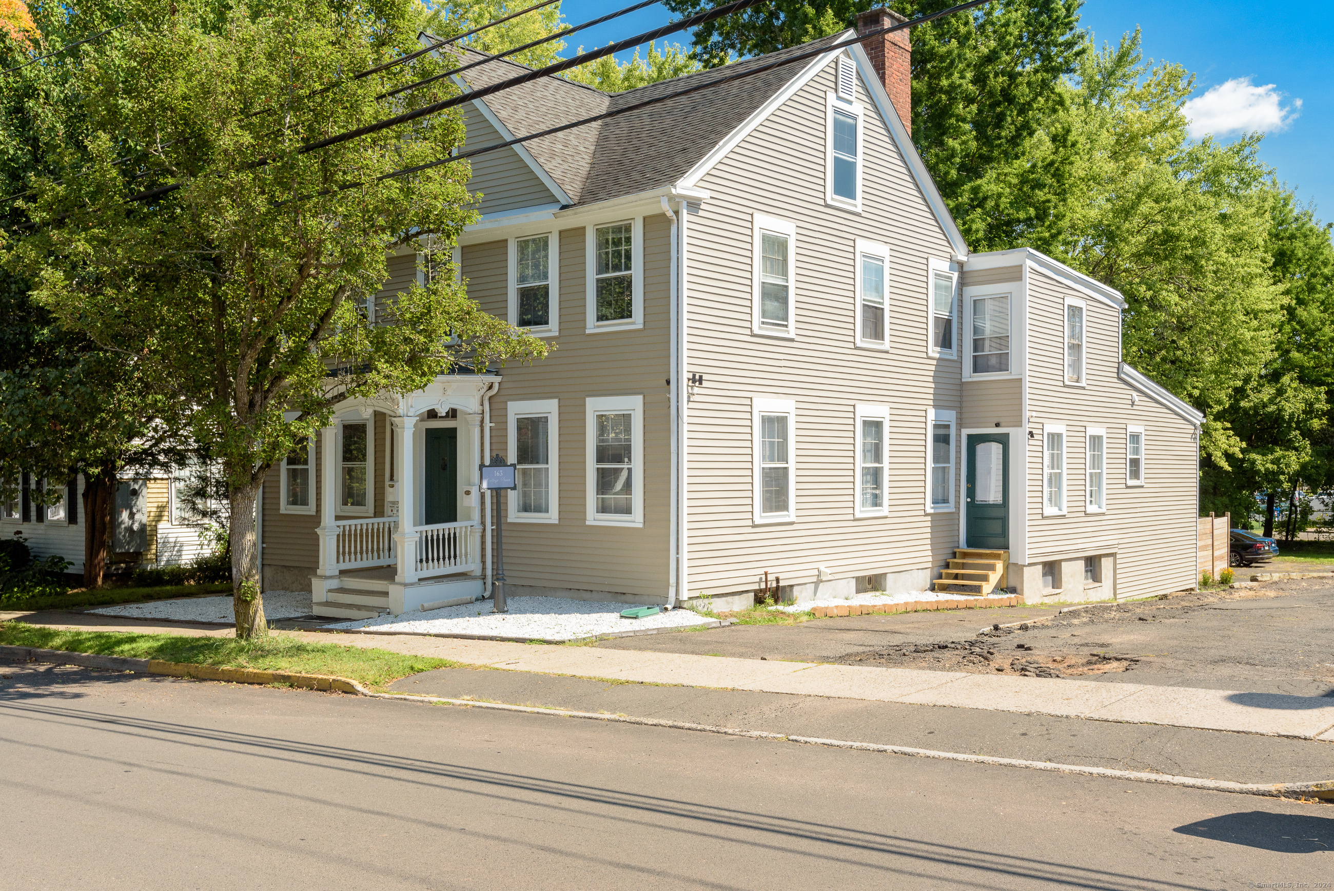 a view of a house with a street