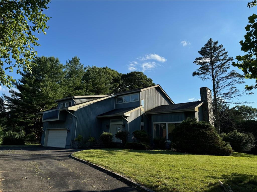 View of front of property with a front lawn