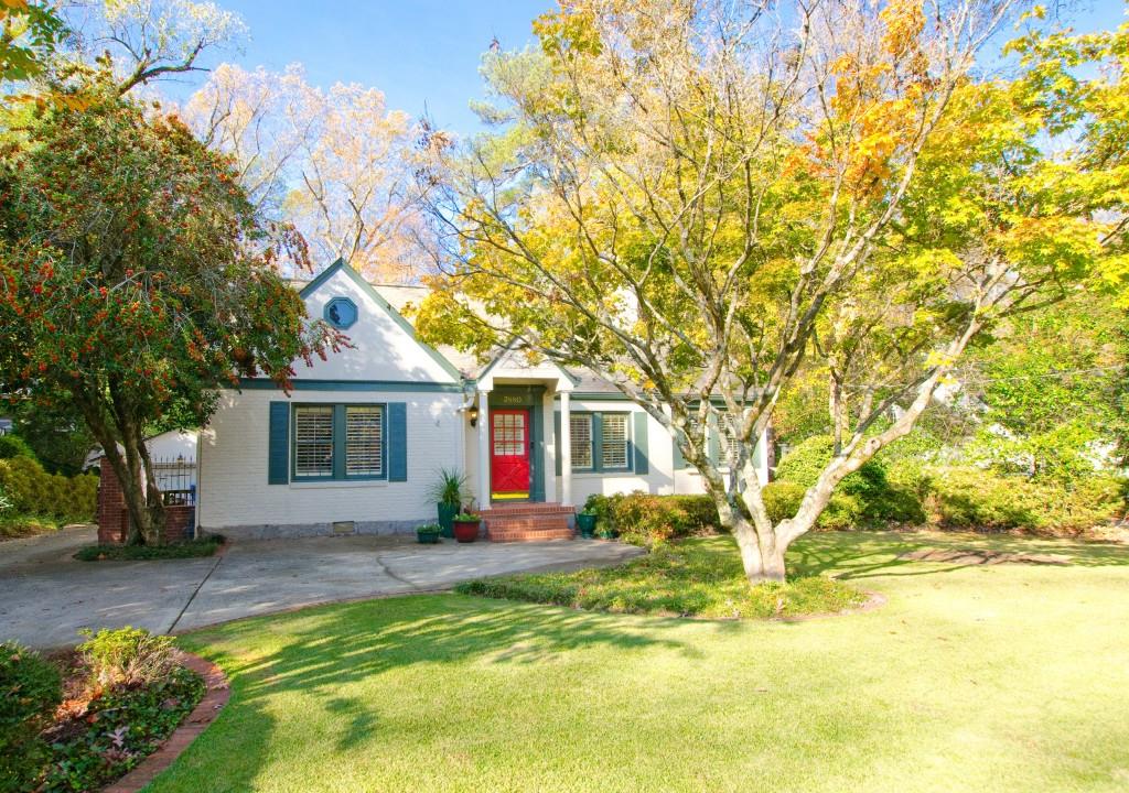 a front view of house with yard and green space