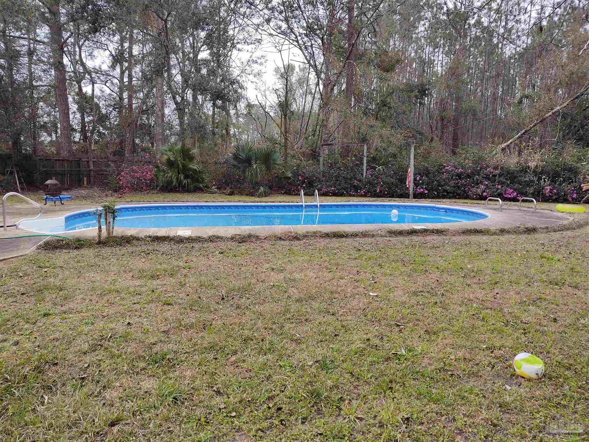 a view of swimming pool with trees