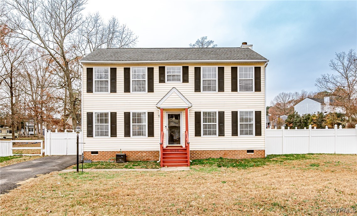 Colonial inspired home with a front yard