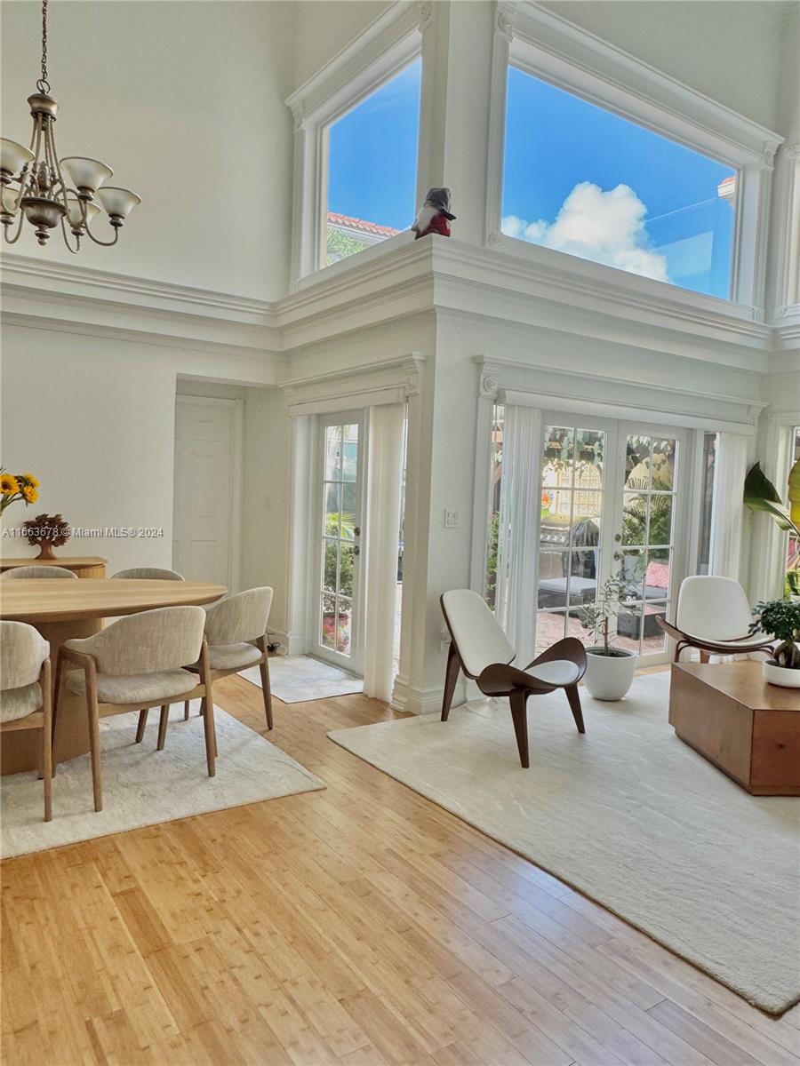 a living room with furniture wooden floor and a table