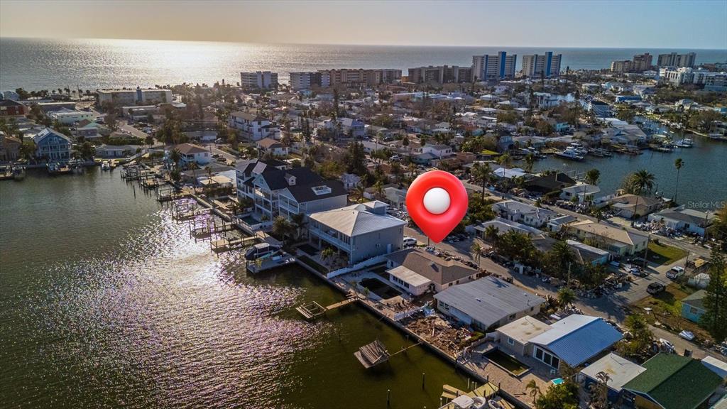 an aerial view of a house with a ocean view