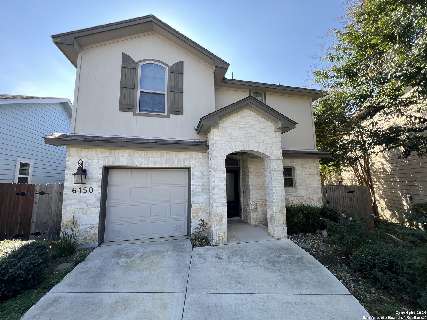 a front view of a house with yard