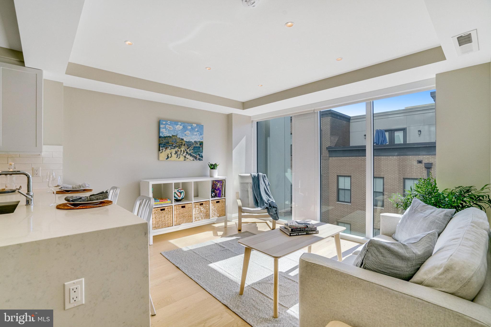 a living room with furniture and a table