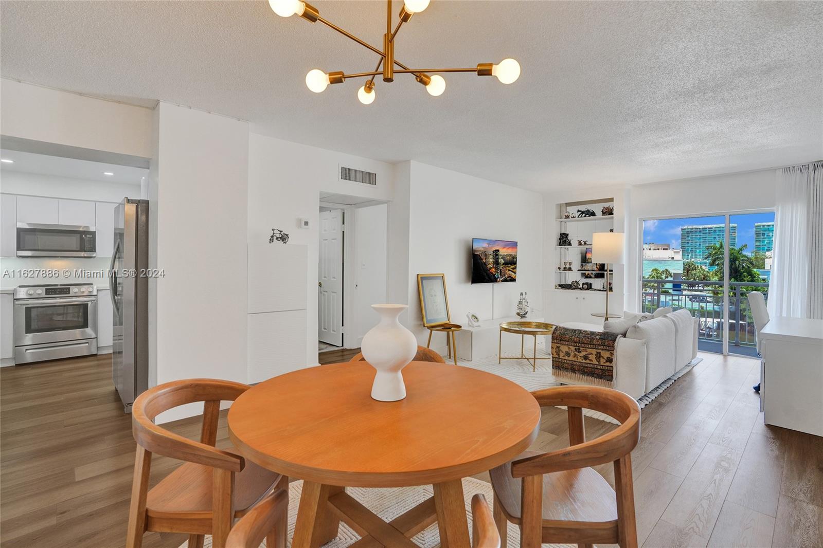 a dining room with furniture and wooden floor