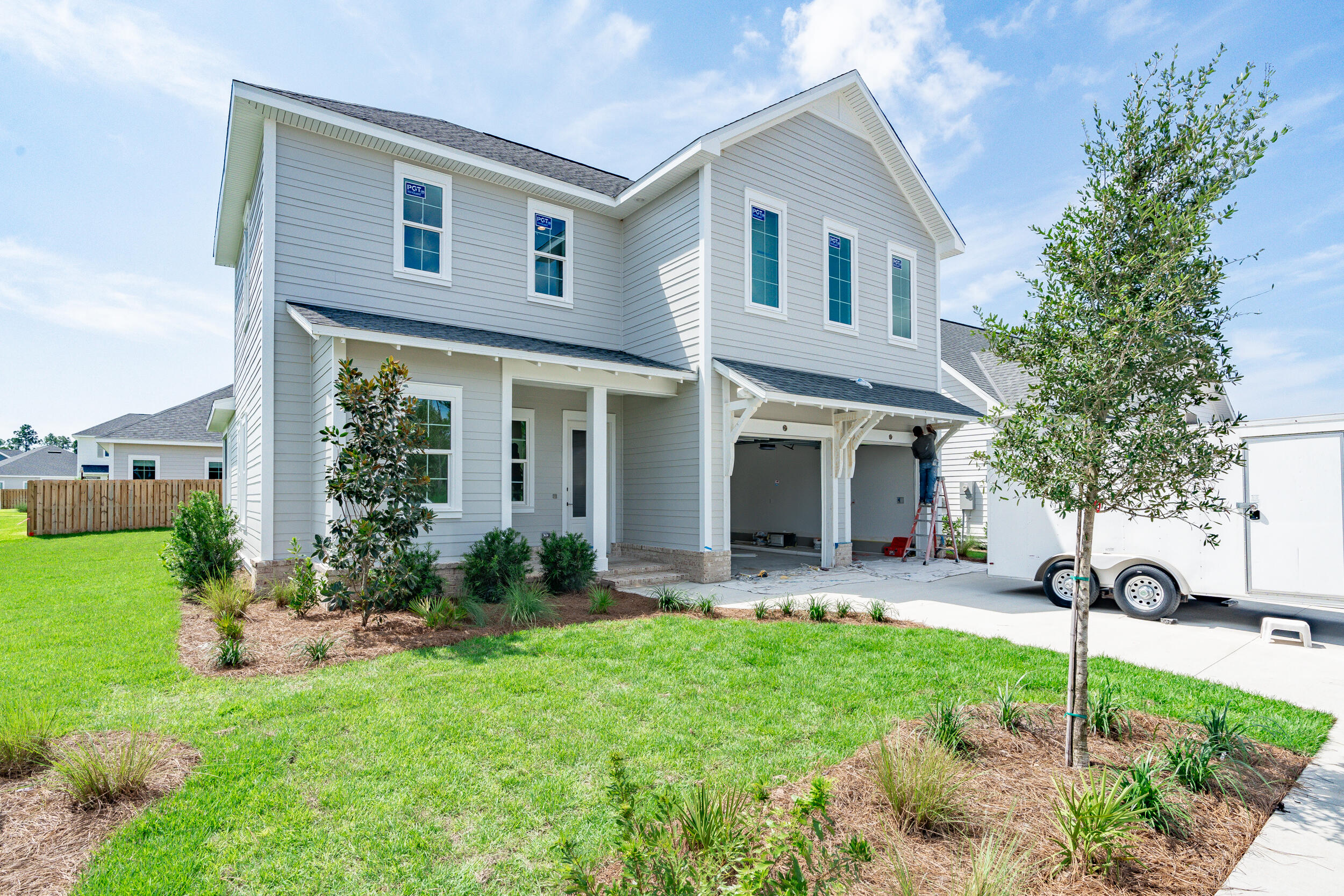 a front view of house with yard and outdoor seating