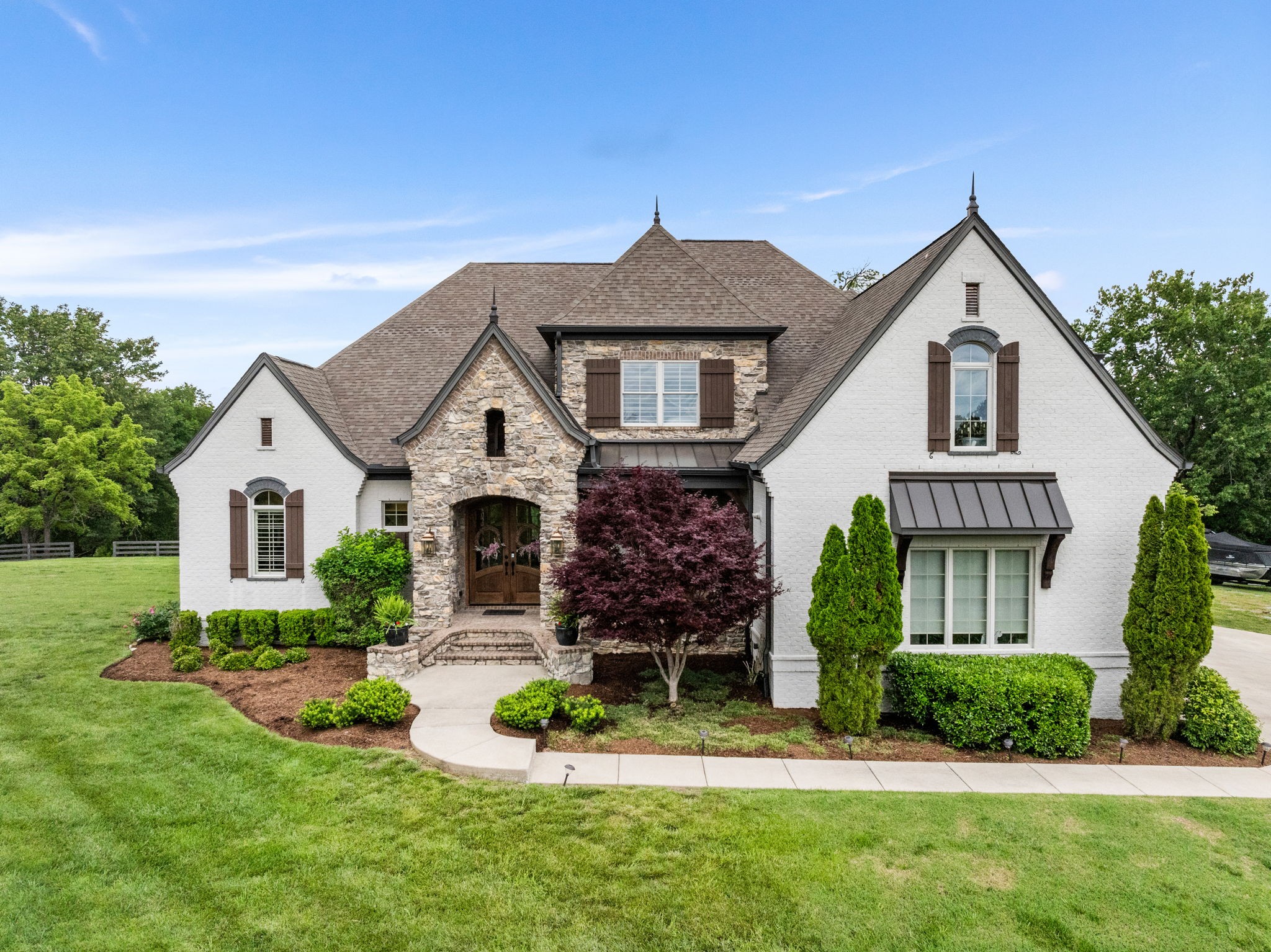 front view of a house with a yard