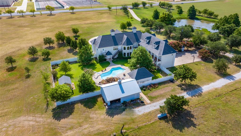 an aerial view of a house with a ocean view