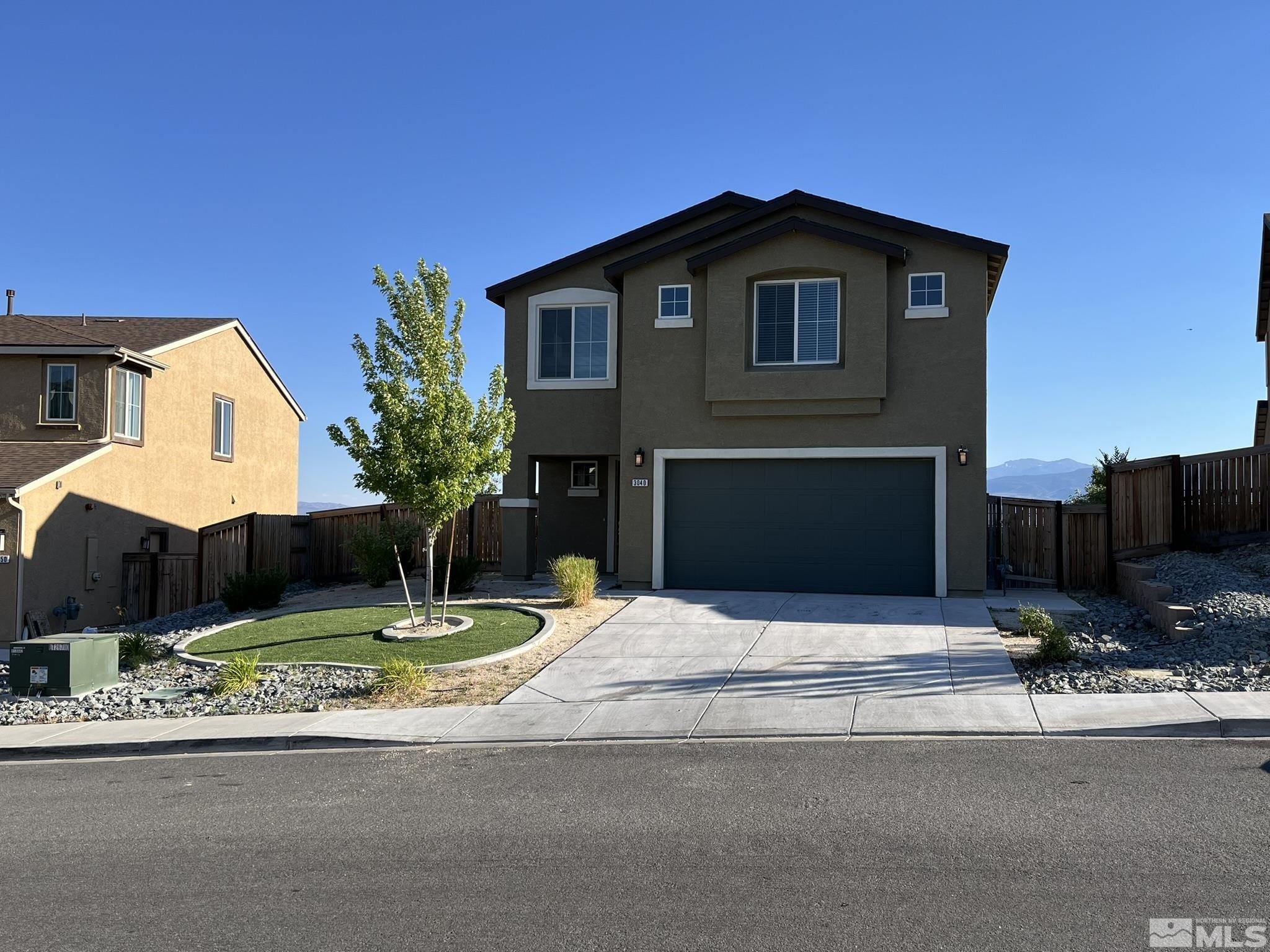 a house with yard in front of it