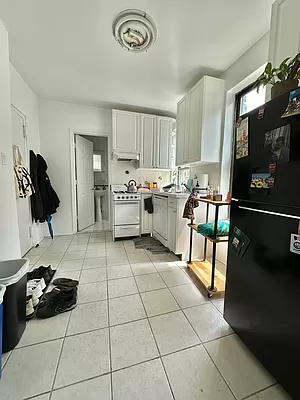 a kitchen with a sink and a stove top oven