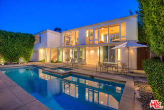 a view of swimming pool with outdoor seating