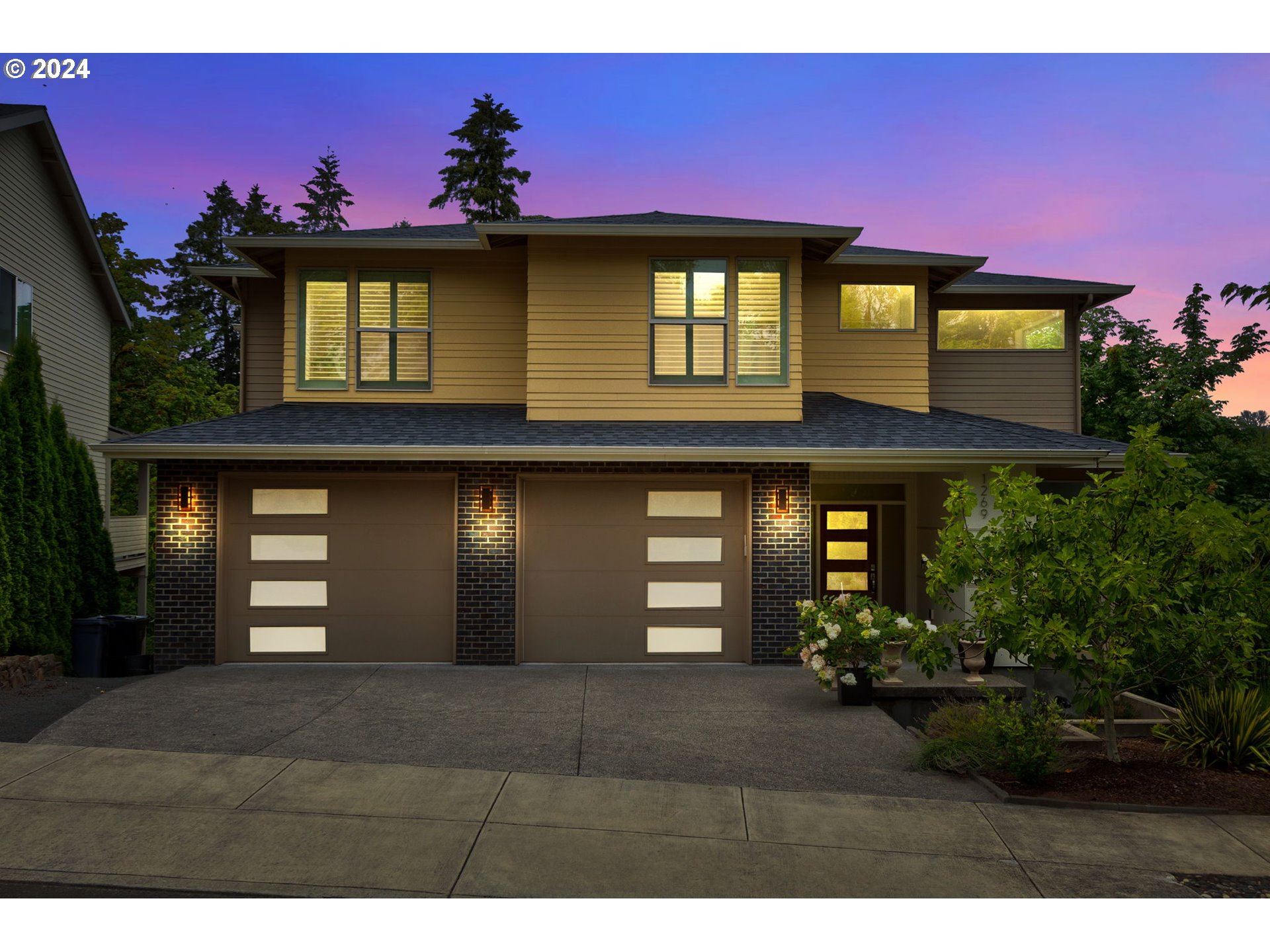 a front view of a house with a yard