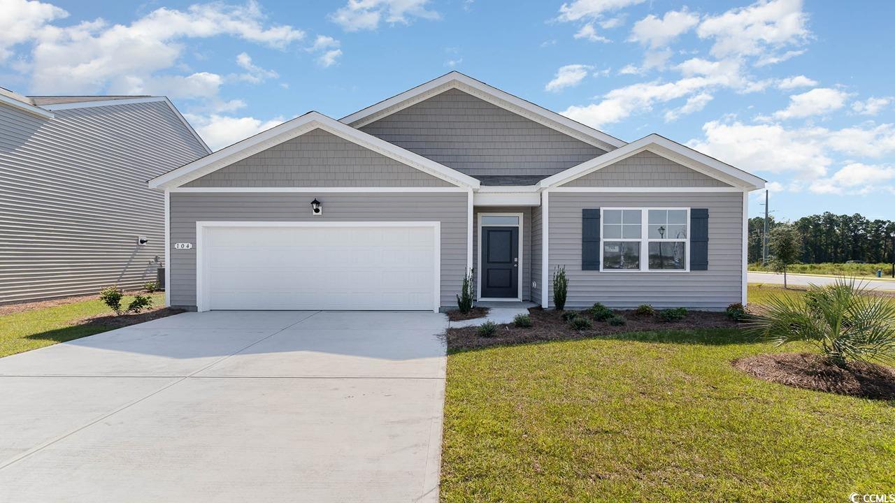 View of front facade featuring a front yard and a