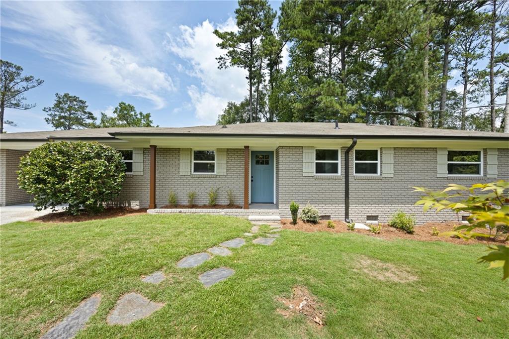 front view of a house with a yard