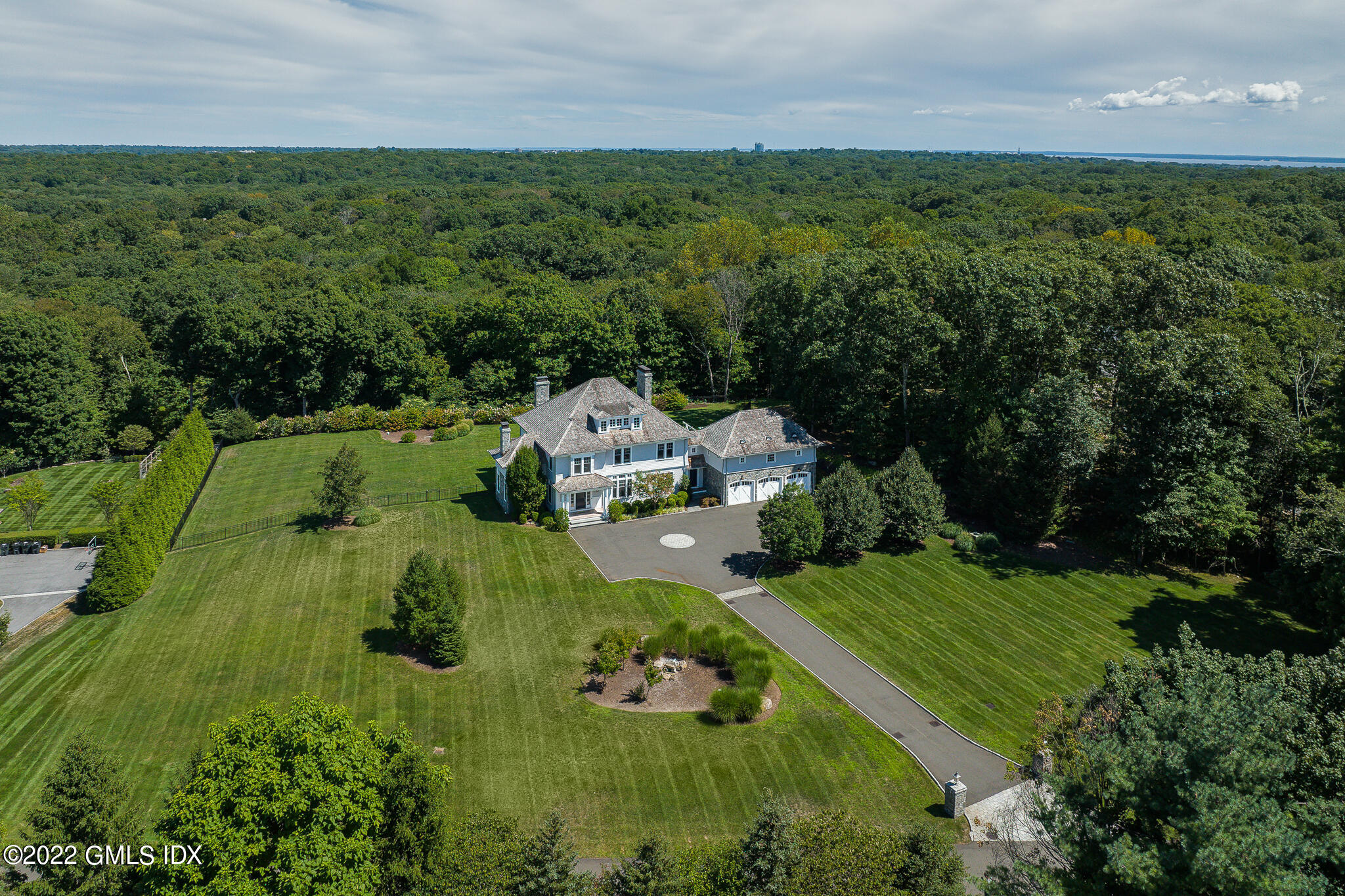 an aerial view of a house with yard