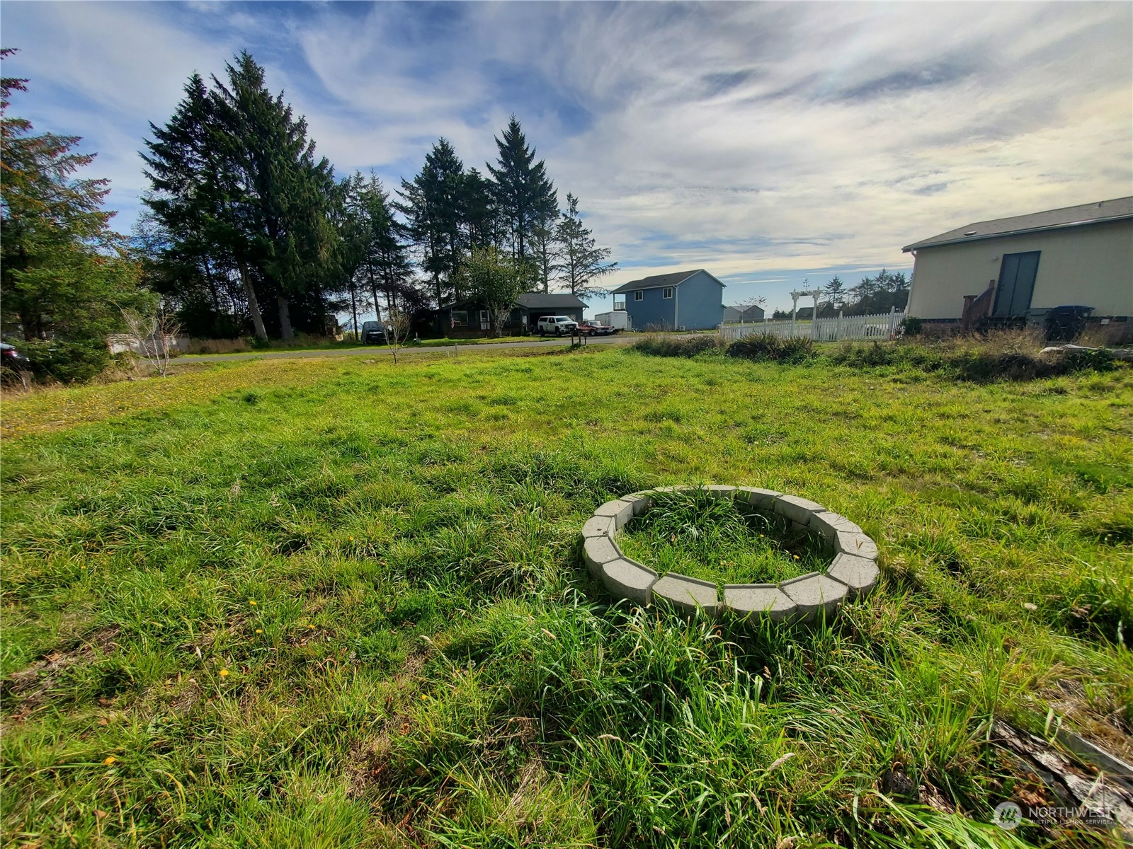 a backyard of a house with yard and trampoline