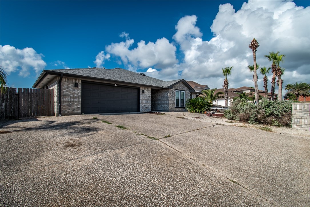 a view of a house with a backyard