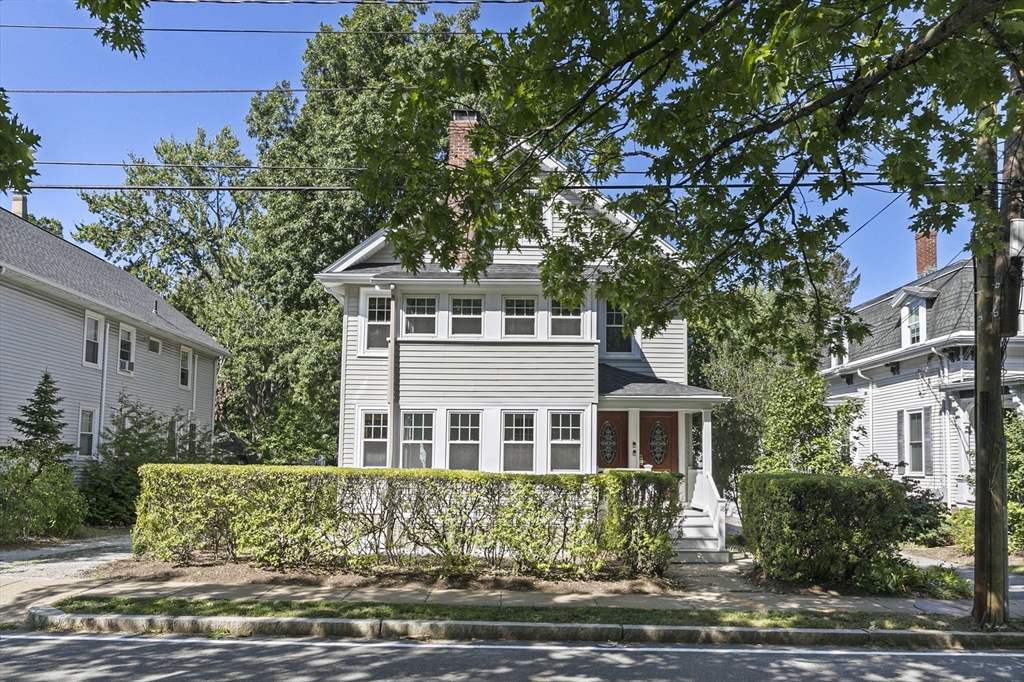 a front view of a house with yard