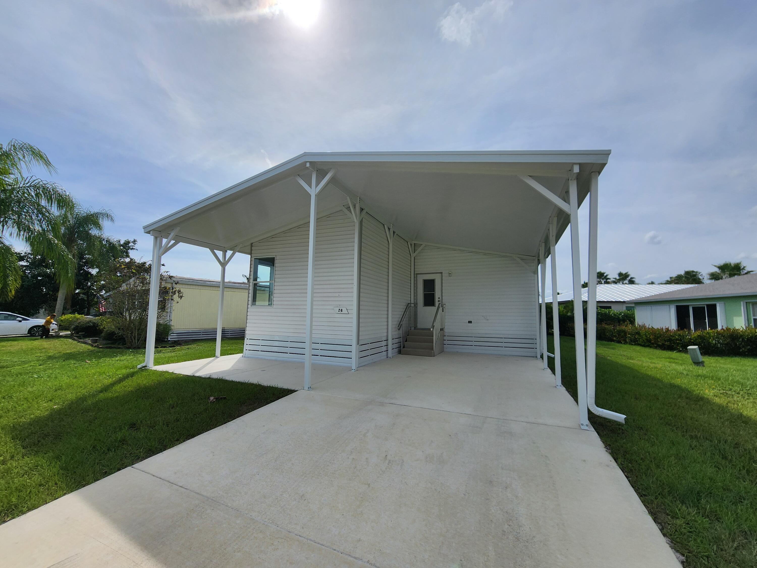 a view of a house with a yard and garage