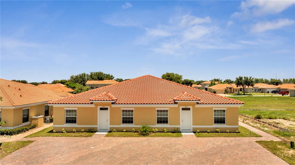 front view of a house with a yard