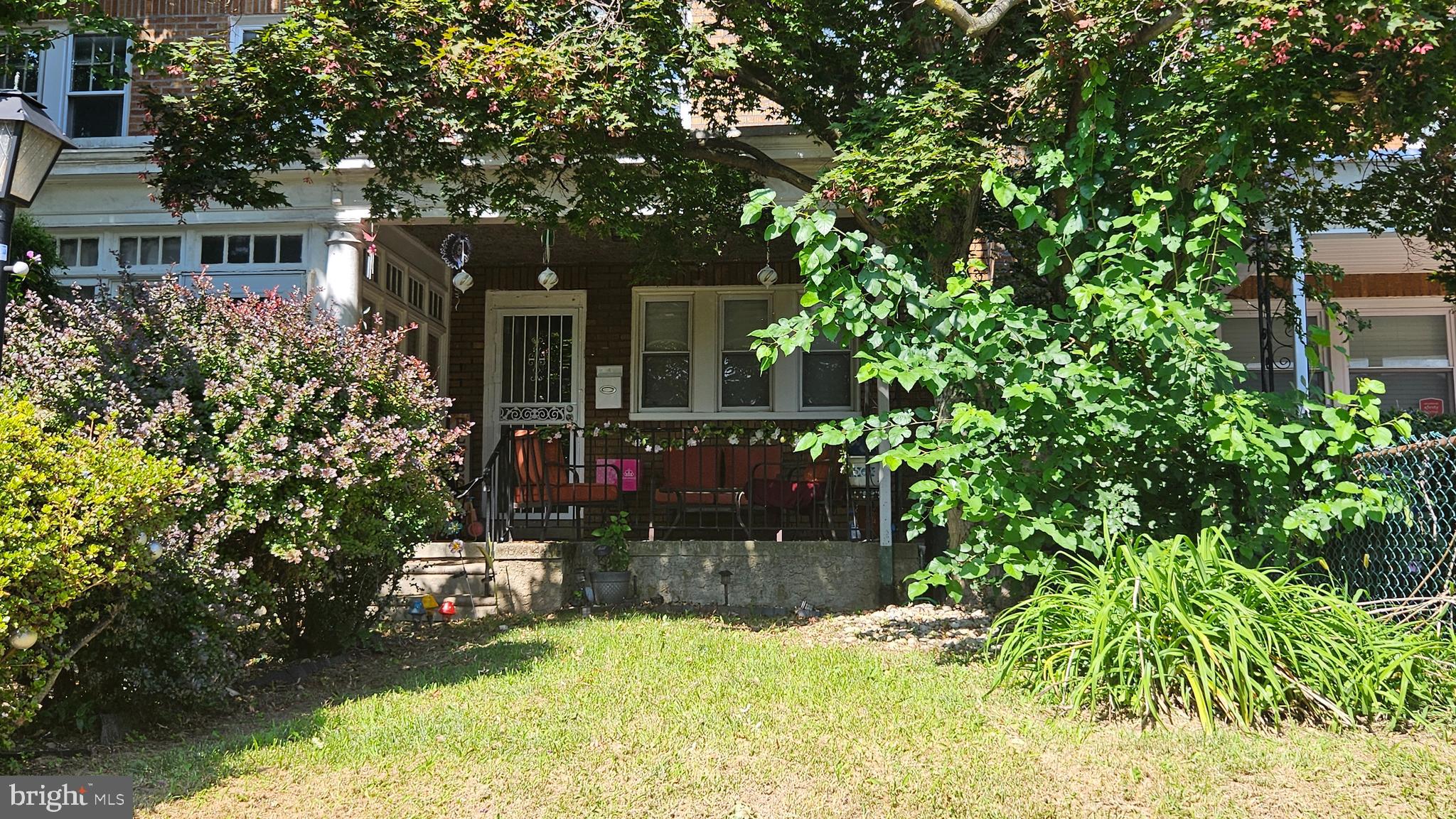 a view of house with yard