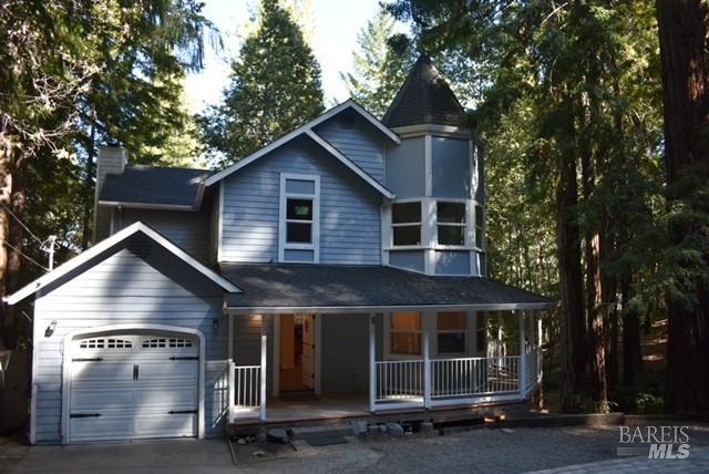 a front view of a house with a garage