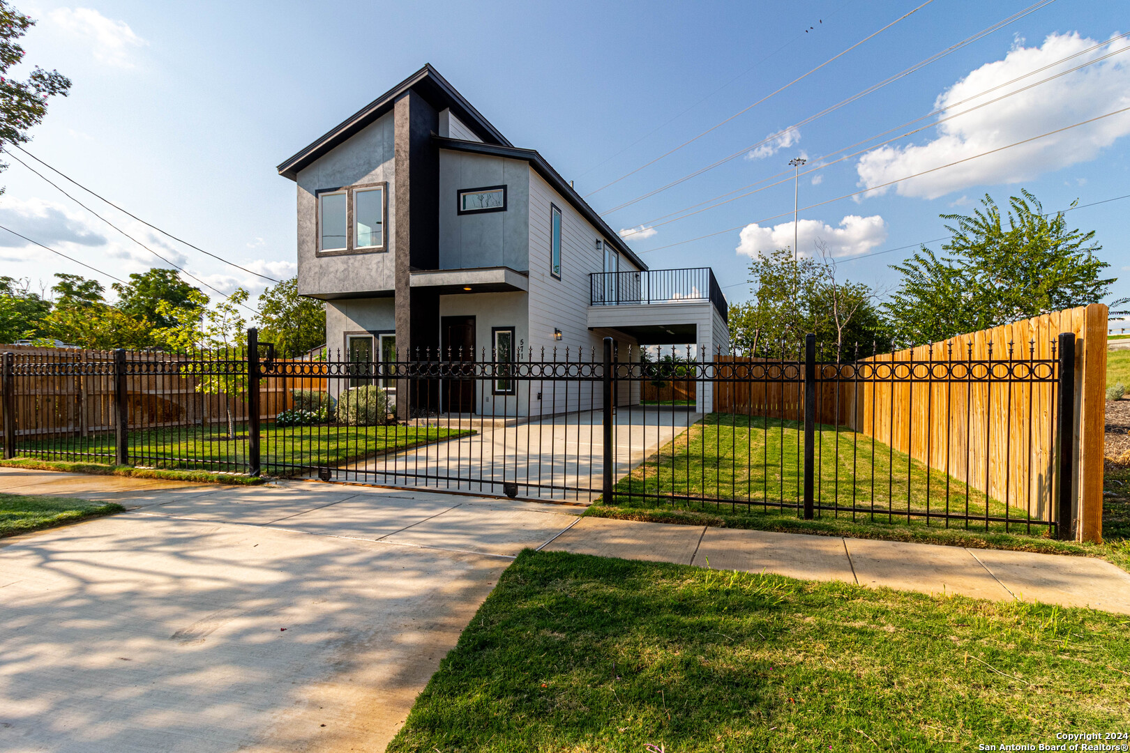 a view of a house and a yard