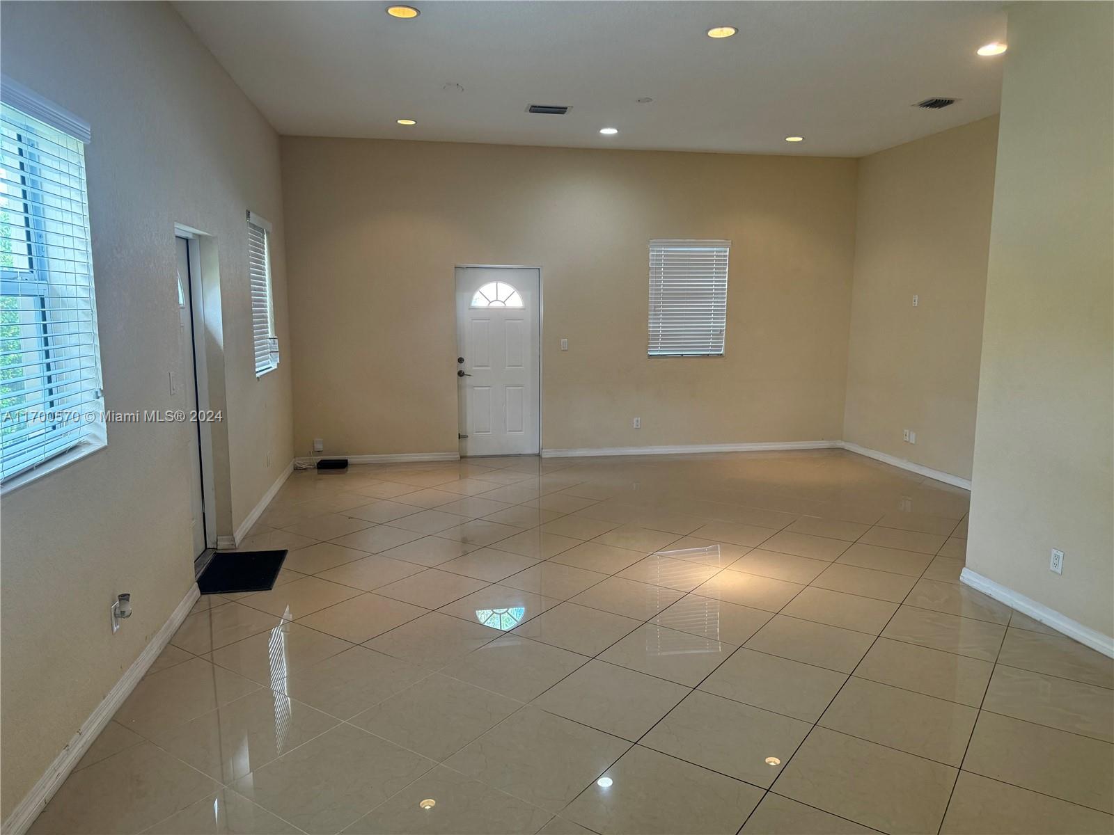 a view of a hallway with windows