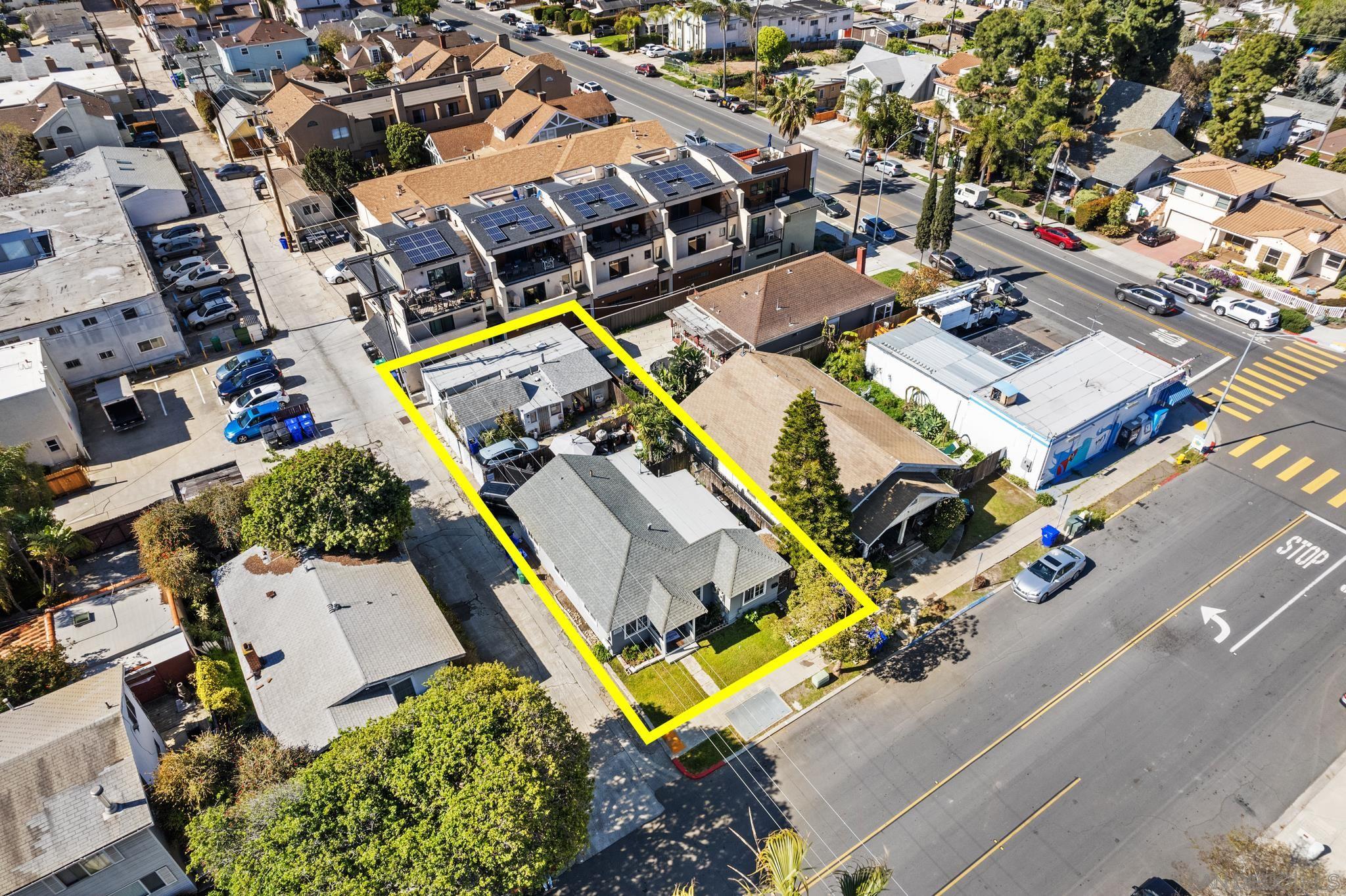 an aerial view of a house with a swimming pool