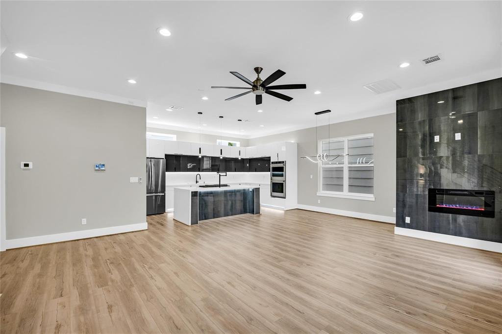 a view of a kitchen with a stove cabinets and wooden floor