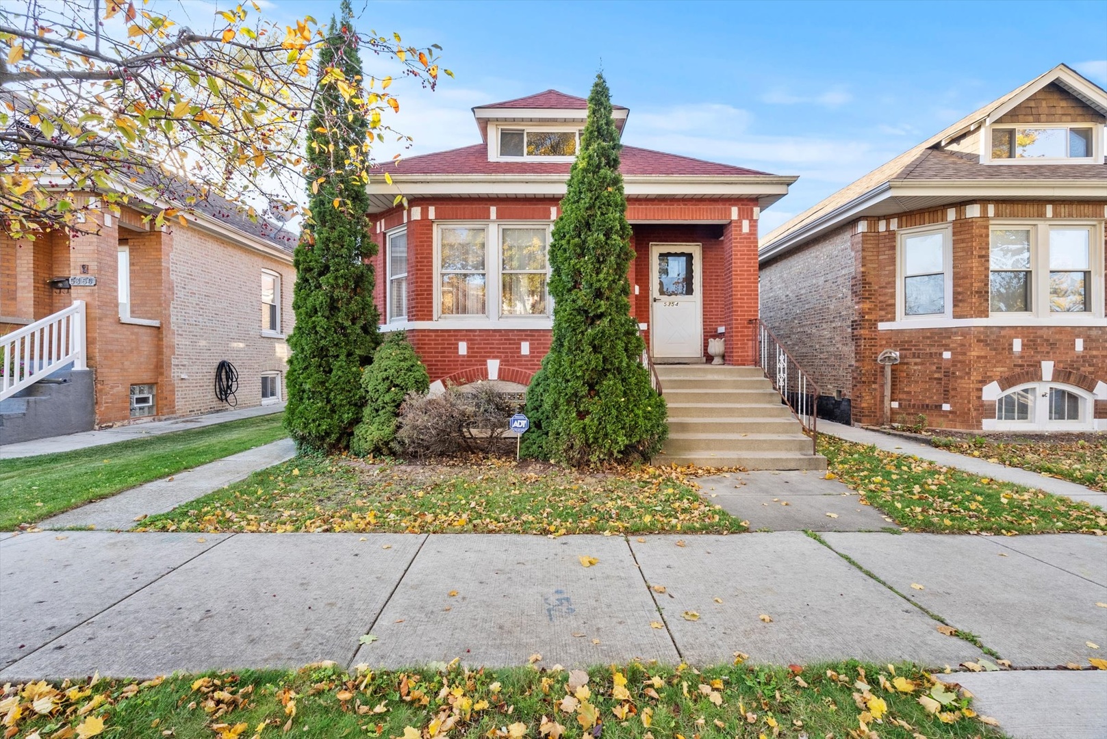 front view of a house with a yard