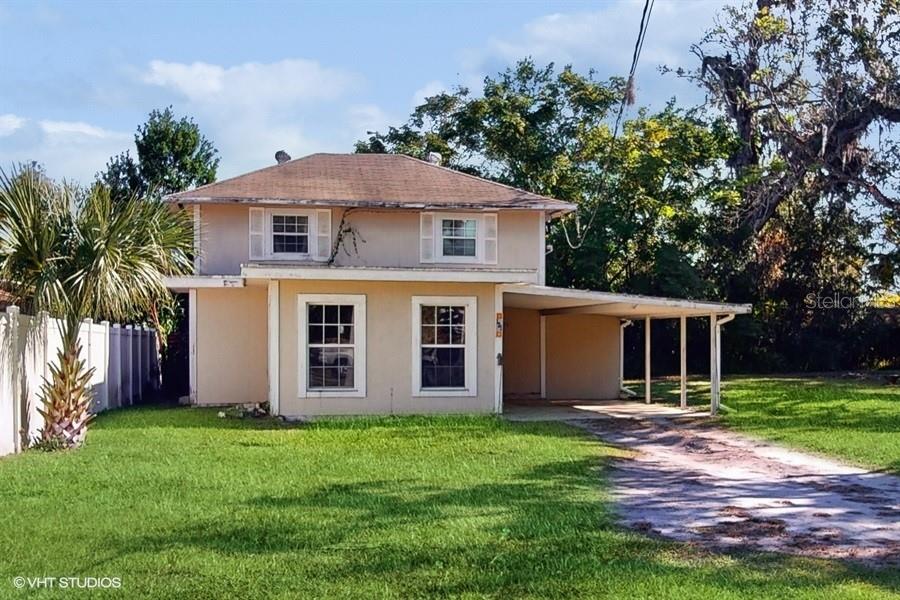 front view of a house with a yard