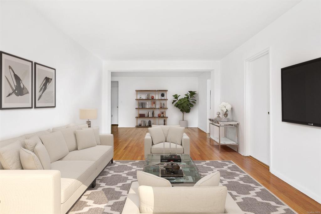 Living room with wood-type flooring