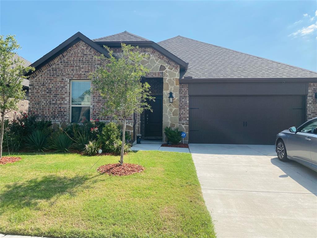 a front view of a house with yard