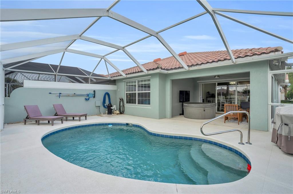 a view of a swimming pool with a patio