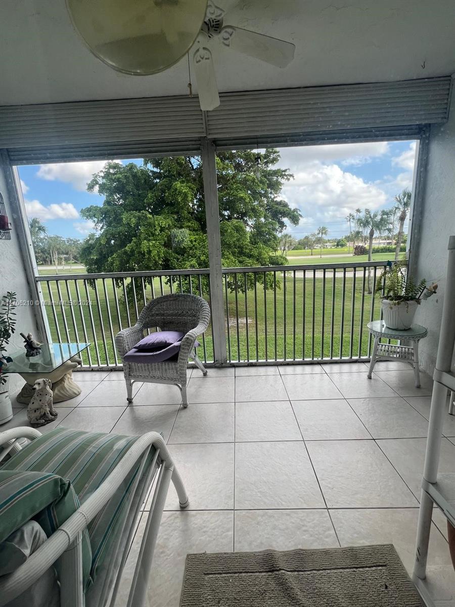 a view of a two chairs in the balcony