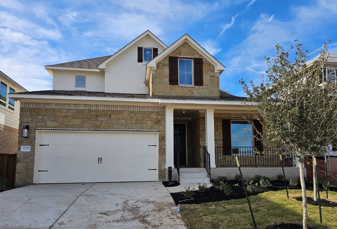 a view of a grey house with a yard