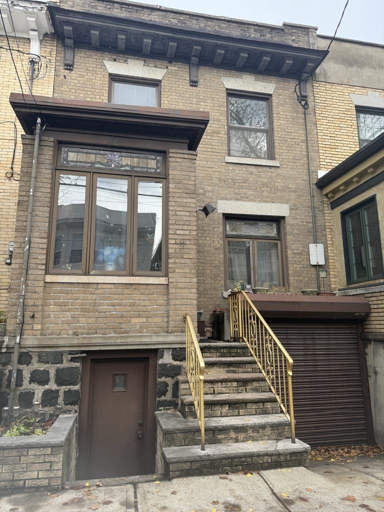 a front view of a house with stairs